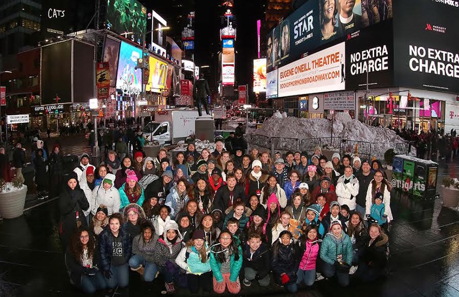 The students of the 2016-17 Washington DC, New York trip take a picture in Times Square.