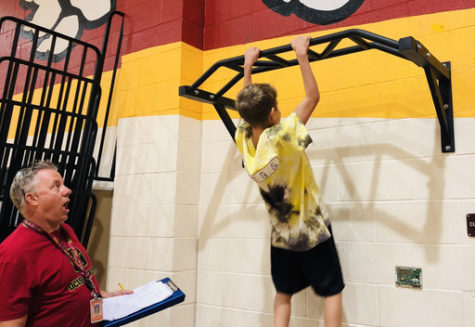 Luke Baker doing pull-ups.