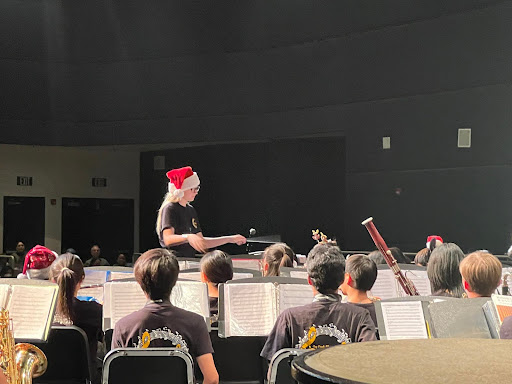 Ella G. conducts warm-ups for the 8th grade band.