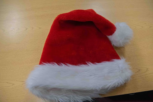 A hat worn by Santa Claus and people during the Holidays.
