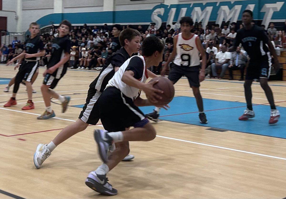 Our 7th grade Coyote, Jacob W., going for a basket at Summit Intermediate.