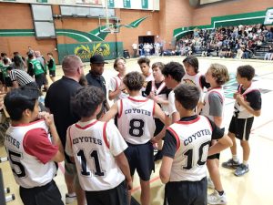 The coaches giving a pep talk during the second quarter. 