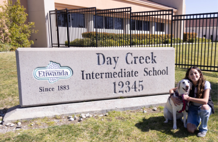 Isabella, the owner of a therapy dog, Sophia.