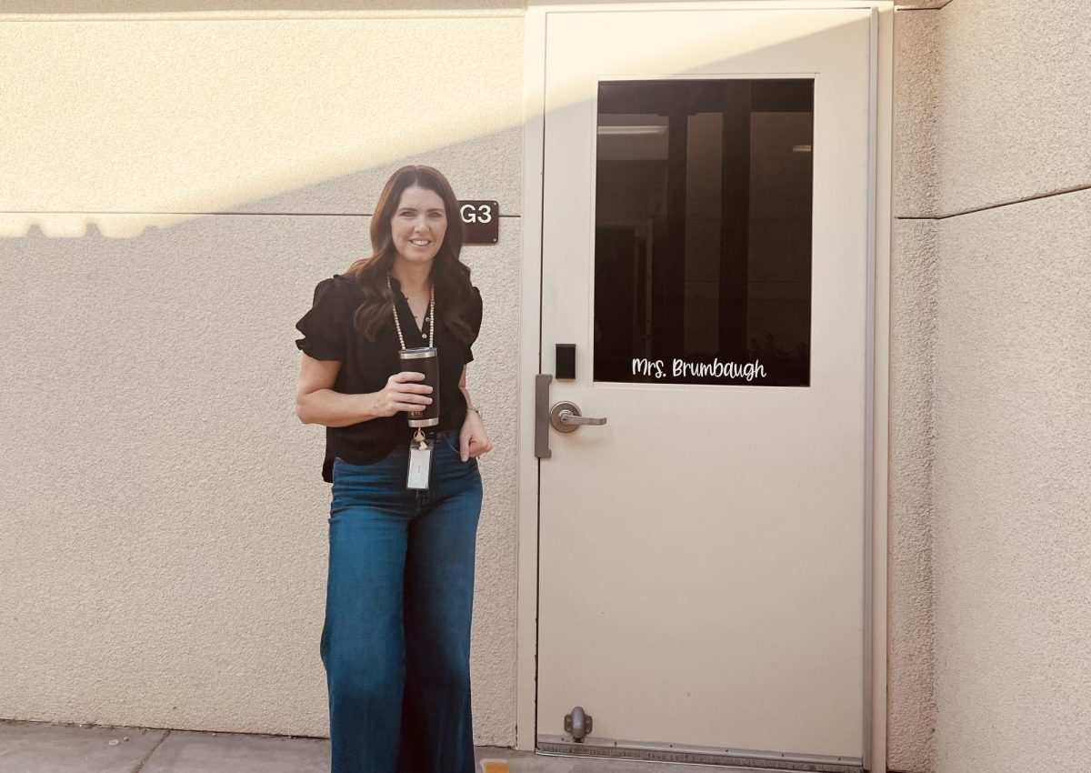 Mrs. Brumbaugh in front of her new 7th grade classroom. 