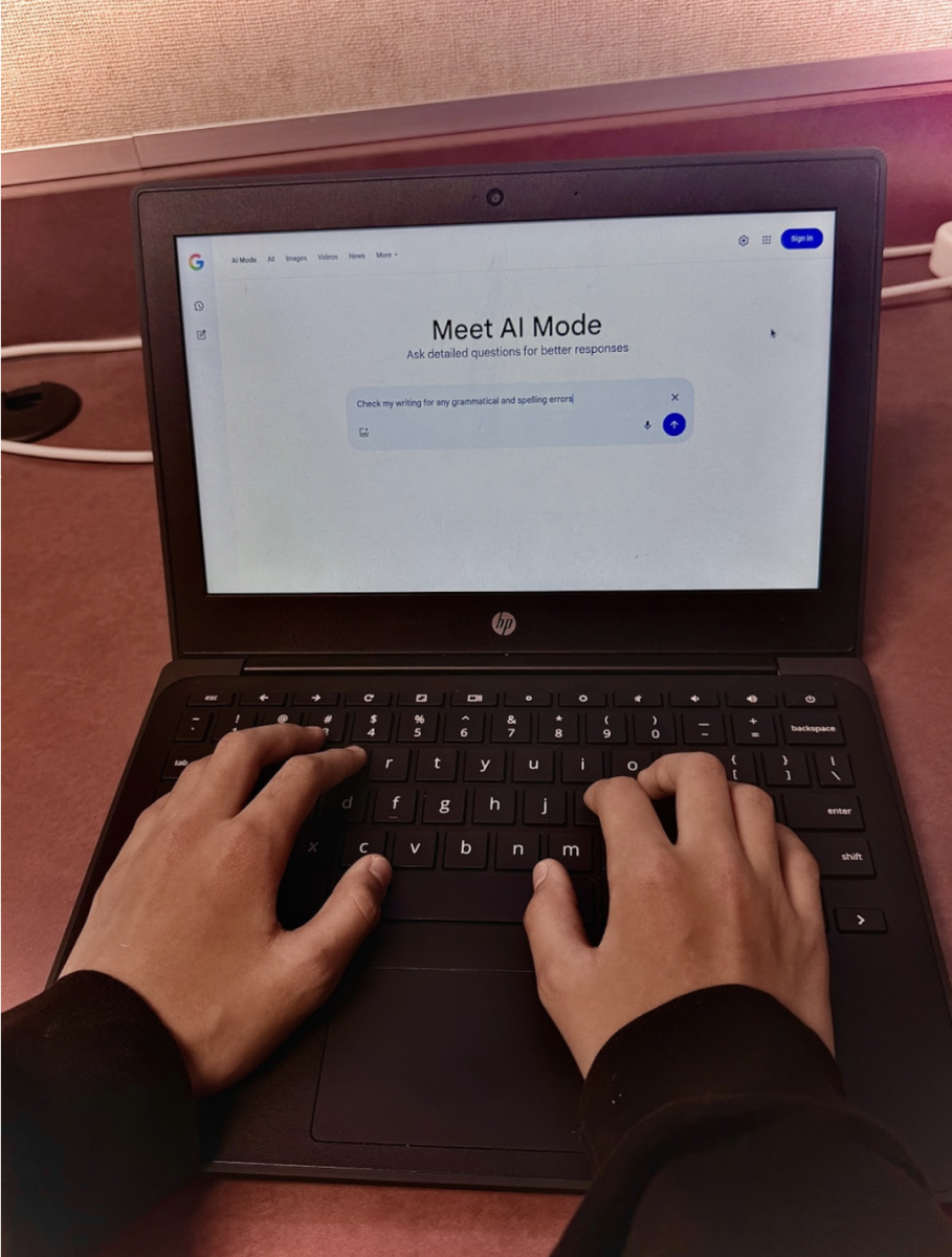 A DCIS student uses AI to help identify potential writing mistakes.
