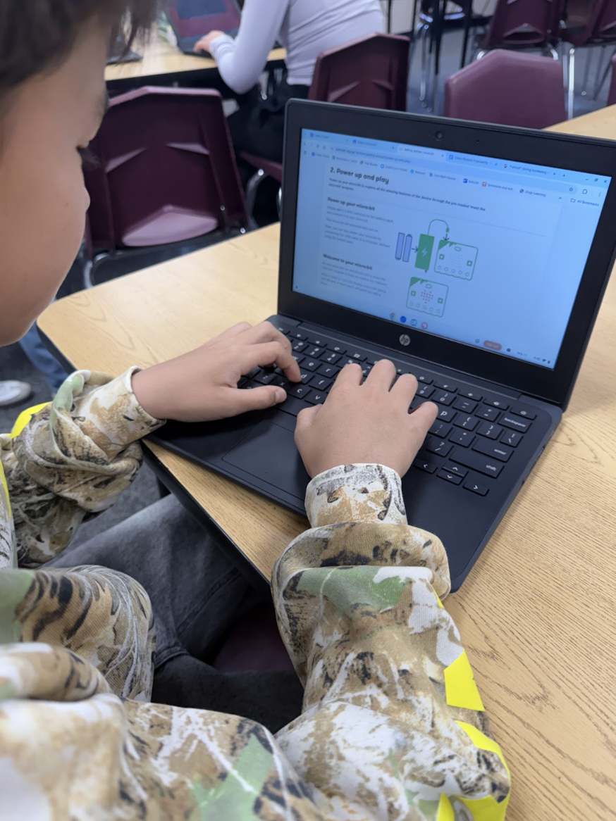 Day Creek student Miles Y. works on coding with Microbits during class.