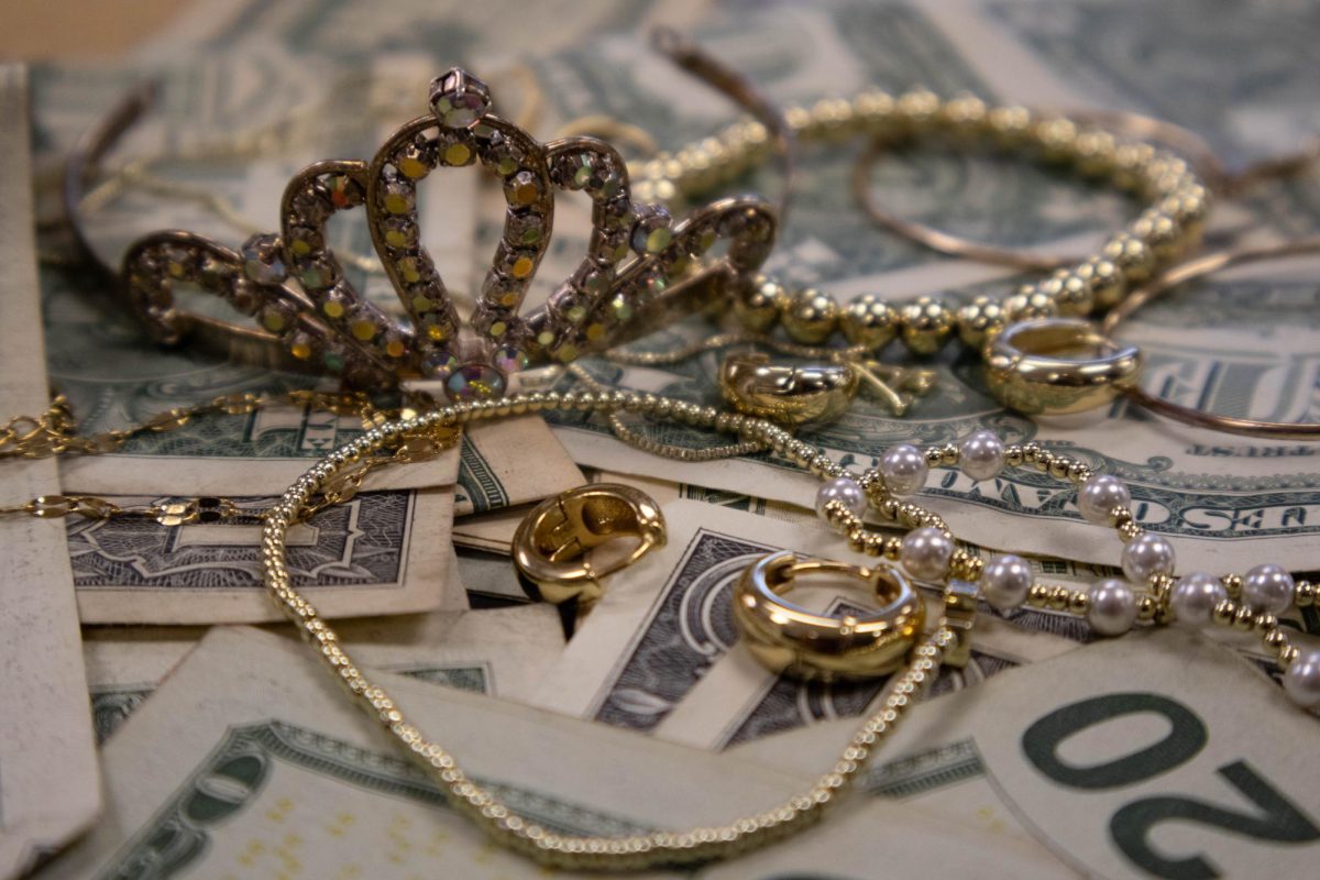 These riches represent the prized jewels the robbers stole.