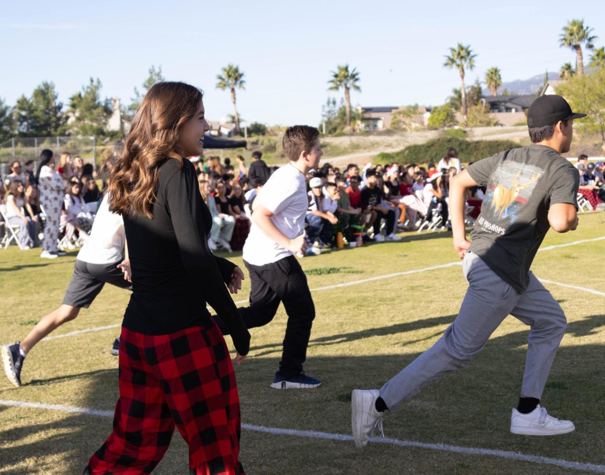 Student team running to congratulate  the teacher team.  