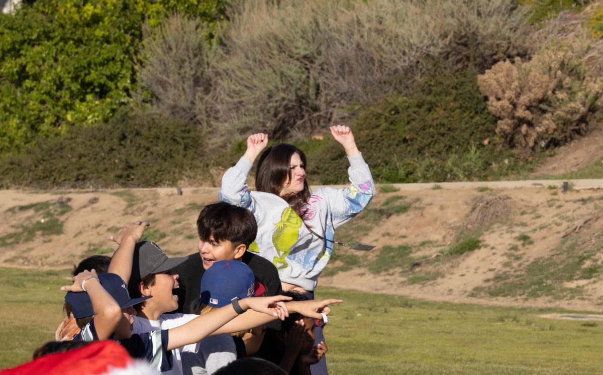 Students react in amazement after Mr. Hernandez's kick. 